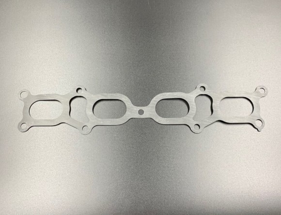 Прокладка впускного коллектора Suzuki DF90-140, DF100-140(A) (Suzuki) Прокладка впускного коллектора Suzuki DF90-140, DF100-140(A) (Suzuki)